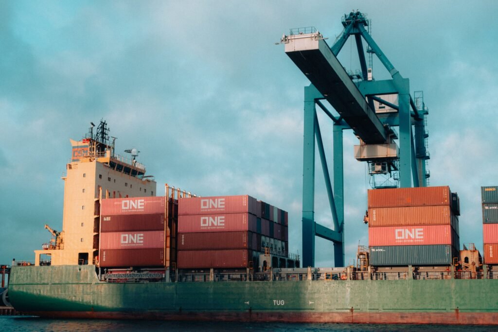 Containers getting loaded onto Ship docked at Port. 